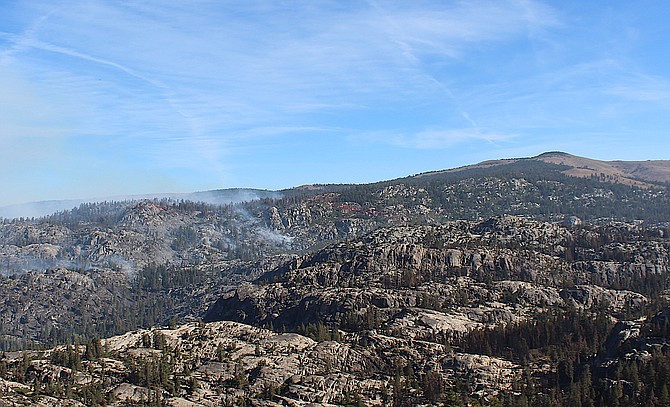 Smoke from fires north of Highway 88 off Carson Spur rises on Thursday morning.