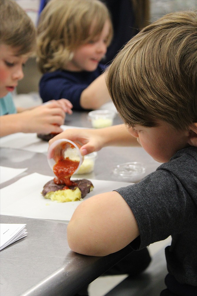 Zephyr Cove Elementary School first graders harvested 150 potatoes from the school garden and made "smashed potato pizzas" with the help from Whittell High School's culinary teacher, Katie Martin recently.