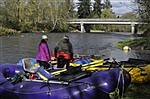 Kayakers clean while they paddle in the Nisqually River