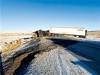 Icy conditions take down semi truck