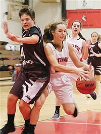 Pershing County varsity girls  basketball team hunt Wolverines