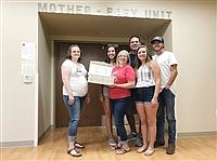 Former resident comes full circle with donation of ‘Angel Gowns’ 