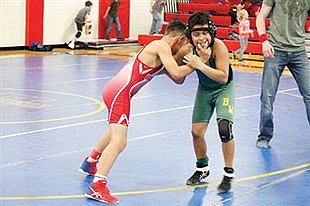 Warriors host wrestling meet before schools close