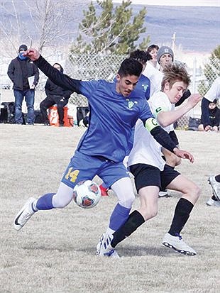 Lowry boys split opening matches