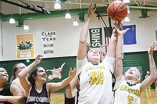 Lady Longhorns rally to beat Wolverines 