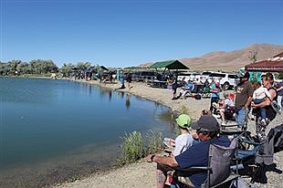 Community pond lures in volunteers and young anglers for maintenance and fishing derby