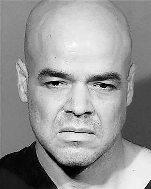 Hearing reset for official jailed in Las Vegas reporter slaying