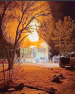 Two in custody after fiery rescue