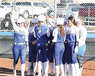 Lowry softball rolls past Hug, North Valleys