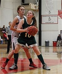 Lady Longhorns split games on the road