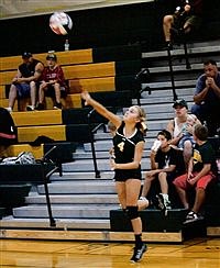 Lady Longhorns split road league games