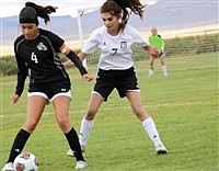 Pershing soccer team splits matches on road