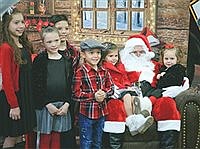 Santa shares cookie stash with kids