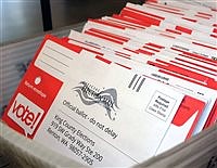County council approves paid-postage ballots