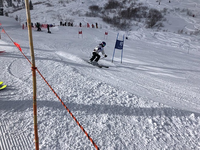 Carson High's Sierra Frame speeds around a gate at Alpine Meadows Tuesday during the Senators' first ski meet of the season.