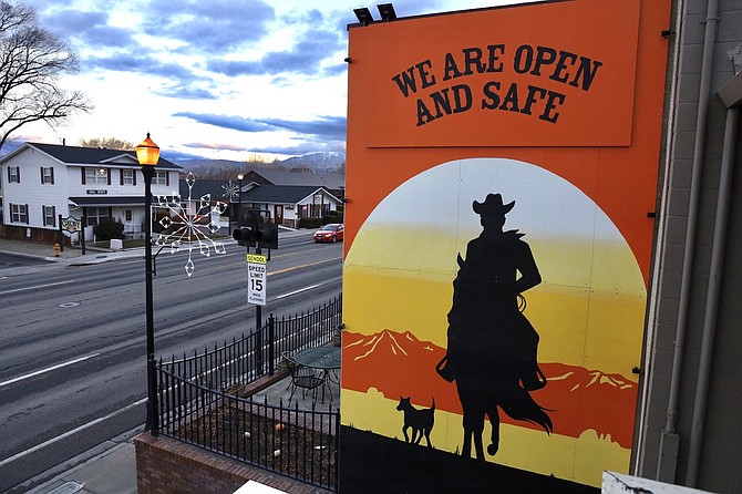 A mural welcomes and reassures shoppers that Gardnerville is open and safe.