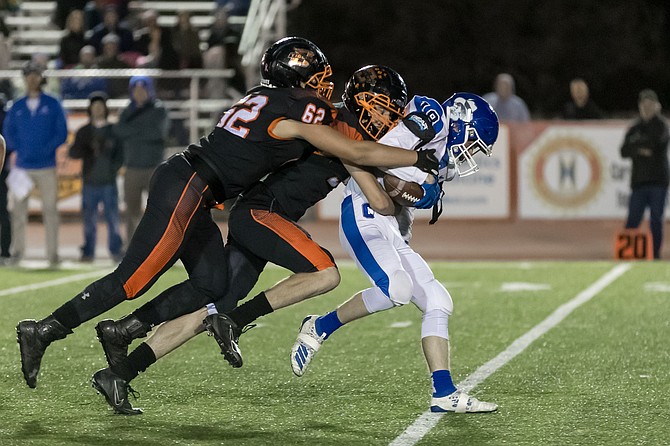 Douglas High's Christian Janota makes a tackle during a contest against Carson High in his junior season. Janota signed his Letter of Intent to continue playing football at the University of Mary (ND) last week.