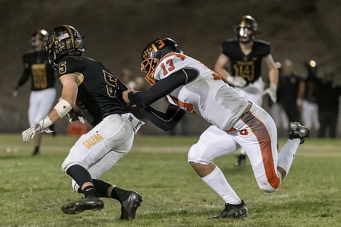 Gabe Foster tracks down a Galena player during the 2019 season.