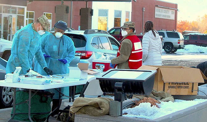 National Guard and health workers at a community testing event before Thanksgiving