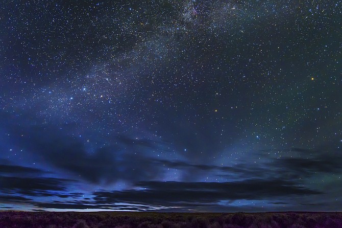In this May 2, 2017 photo provided by Kurt Kuznicki is the Massacre Rim Wilderness Area in northwestern Nevada, 150 miles north of Reno and near the state line with Oregon. Massacre Rim is one of two areas designated as "dark sky sanctuaries" in Nevada. A bill passed by the Nevada state Senate would create a state program to encourage tourism and preservation of dark sky places. (Kurt Kuznicki via AP)