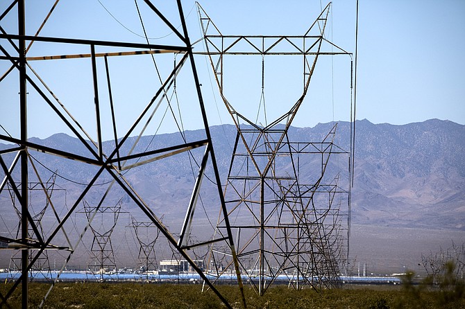 Power lines from Hoover Dam stretch through Eldorado Valley south of Boulder City on Friday, June 16, 2016.