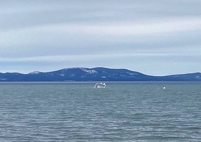 An abandoned boat sunk off Pope Beach is scheduled to be raised today.