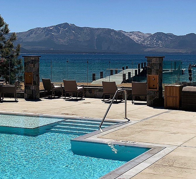 An outdoor pool at Tahoe Beach Club overlooks Lake Tahoe.