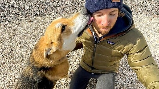 Tahoe resident Kyle Johnston gets a kiss from his pooch. Johnston survived an avalanche on Feb. 12 near Blue Lakes in Alpine County.