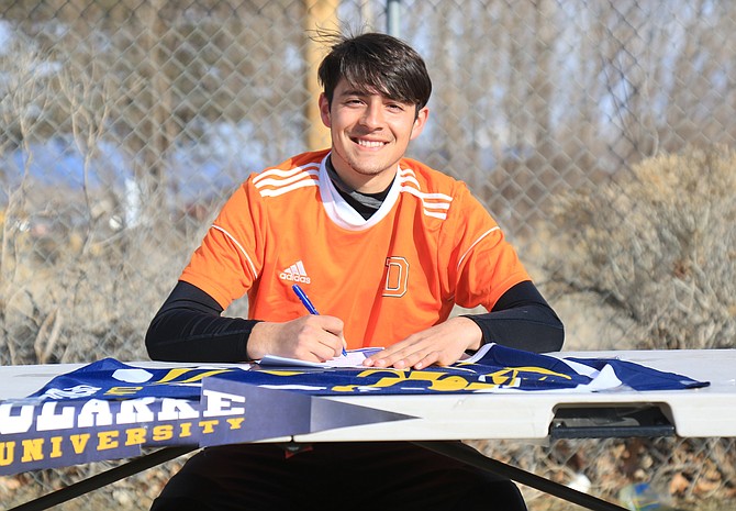 Douglas High senior Ricky Diaz smiles after signing his national Letter of Intent to play men’s soccer at Clarke University next year. Diaz will join his older sister, Vaneza, in Dubuque, Iowa next fall.