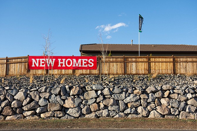 Signs advertising new houses in Verdi, Nev. on Friday, March 6, 2020.