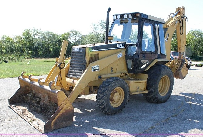 A backhoe with the words Deja Vu stenciled on the arm was stolen last weekend.