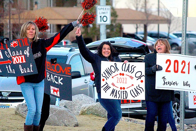 Parents of Douglas High School seniors greeted students at the school on Tuesday morning.