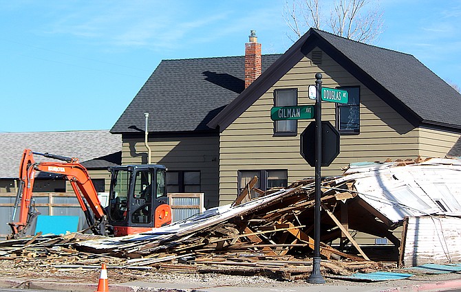 The vacant house at Gilman and Douglas avenues was taken down on Tuesday.