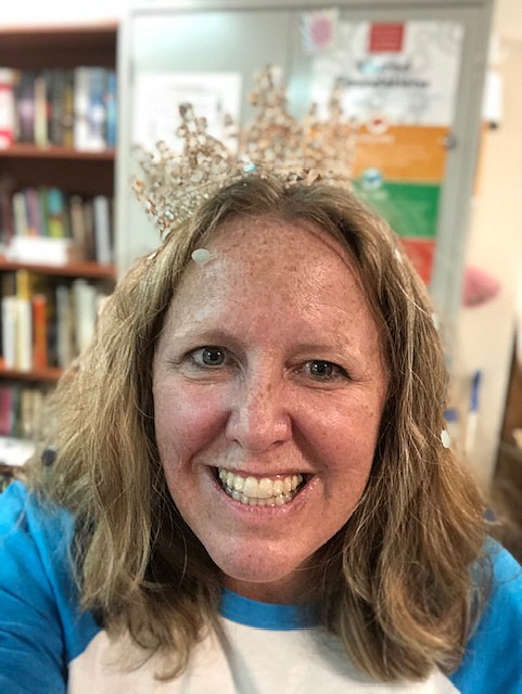 CHS Educator of the Year is Media Specialist and Librarian Ananda Campbell receiving a crown and confetti celebration at the March 15 staff meeting