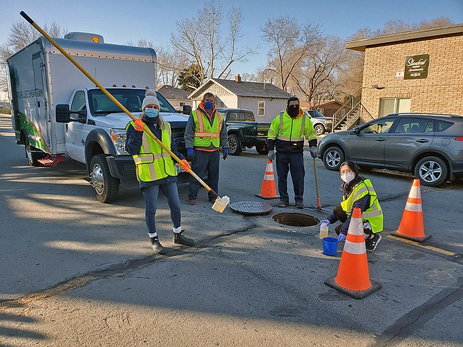 University of Nevada, Reno researchers and City of Sparks staff collect samples of wastewater to test for prevalence of SARS-CoV-2 virus in the community.