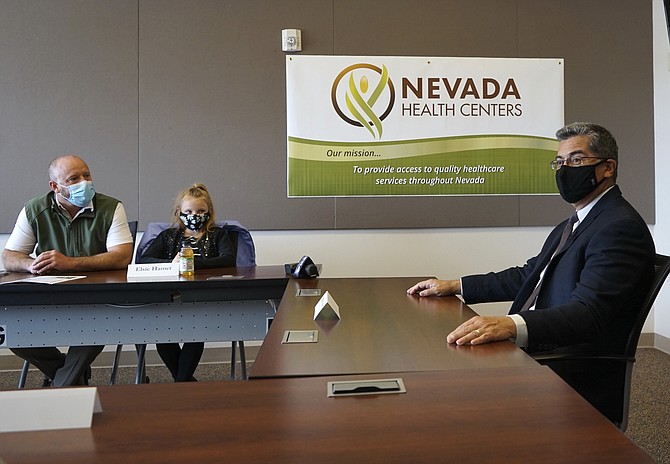 U.S. Health and Human Services Secretary Xavier Becerra sits during a meeting at the Nevada Health Centers in Carson City on Tuesday. (Samuel Metz/AP)