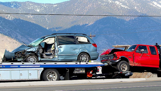 A minivan and red pickup involved in a collision at Highway 395 and Muller Lane on Thursday morning.