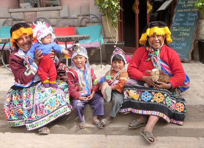 Typical all over Peru, natives dress in their colorful attire. Grandma, Mom and kids shown here in a small village on the way to the Sacred Valley.(Photo: Courtesy Ronni Hannaman)