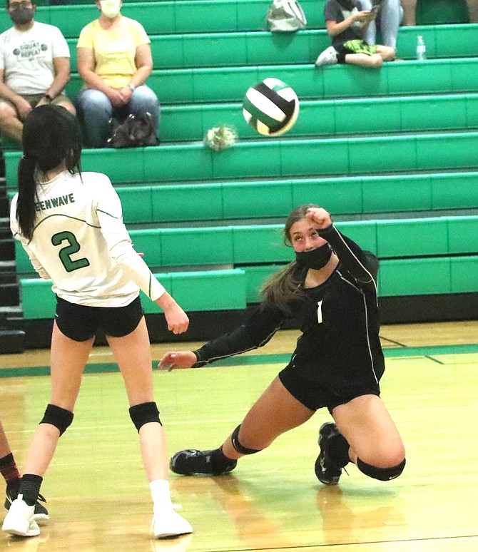 Fallon’s Sativa Clark gets the one-handed dig against Lowry as teammate Lacee Wallace watches.