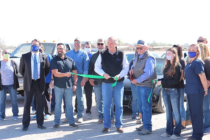 Churchill County had a ribbon-cutting at its new COVID vaccine site off Miners Road. Mayor Ken Tedford, center, holds one end of the ribbon, and Churchill County Chairman Pete Olsen grips scissors.