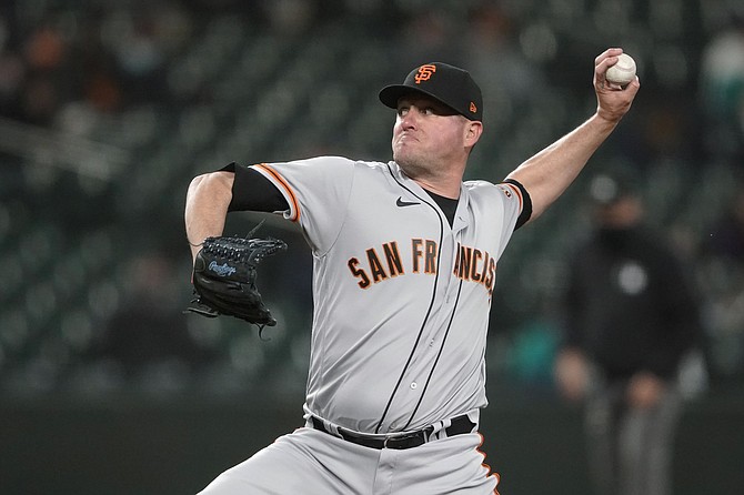 San Francisco Giants closing pitcher Jake McGee pitches against Seattle during the ninth inning April 2 in Seattle. McGee earned the save as the Giants won 6-3. (Photo: Ted S. Warren/AP)
