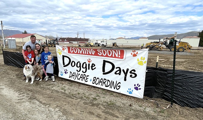 Doggie Days owners Tim and Kristy Peters and their daughters, left to right, Brynlee, 9, Emmi, 6, Braylee, 7, and Brea, 3, and their Australian shepherd Neva celebrate their groundbreaking of their new Doggie Days Daycare and Boarding facility on Thursday. The facility is expected to open in October. (Photo: Jessica Garcia/Nevada Appeal)