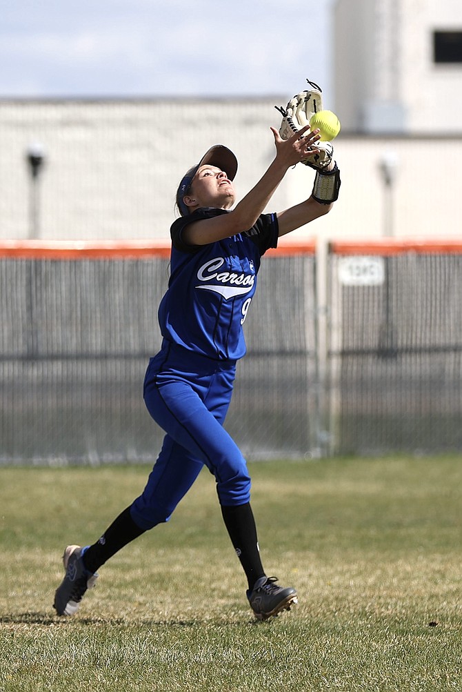 Carson High's Amberlee Ketten runs in fromt right field Thursday afternoon to make a catch against Douglas. Ketten is one of four seniors on the Senators' roster this season.