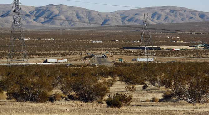 The site of a proposed station for the DesertXpress high-speed rail line to Las Vegas, foreground, with Interstate 15 in the background, on the far outskirts of Victorville, Calif., shown Jan. 25, 2012. (Photo: Reed Saxon/AP, file)