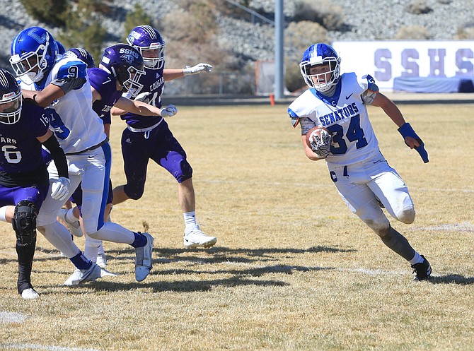 Carson High’s Ben Heaton (34) turns the corner against Spanish Springs this spring. Heaton was named a first-team all-region linebacker.
