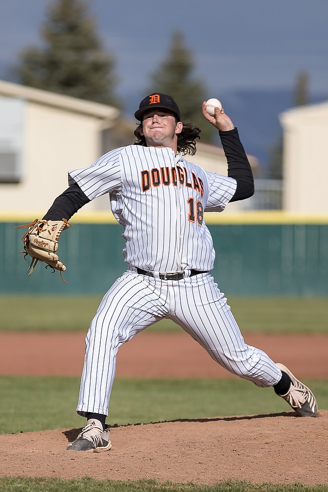 Douglas High senior Matt Goff releases a pitch against Carson High last Thursday. Goff and the eight other Tiger seniors will have a sprint to the finish in a shortened spring season.