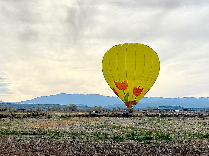 Gardnerville Ranchos resident Terry Burnes took this photo of the Lake Tahoe Balloon landing east of the Pine Nut Road roundabout south of town.