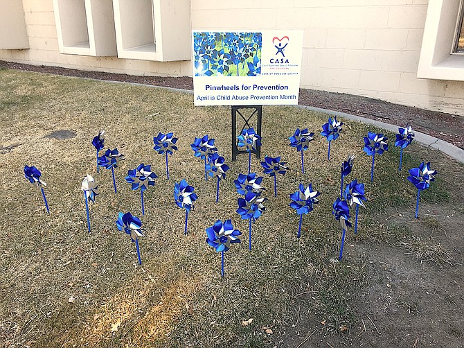 Pinwheels set up in front of the Judicial and Law Enforcement Center in Minden remind visitors that April is Child Abuse Prevention Month. Court Appointed Special Advocates are always looking for responsible adults to speak for children in court. You can find out more at https://douglasdistrictcourt.com/court-advocates/casa/