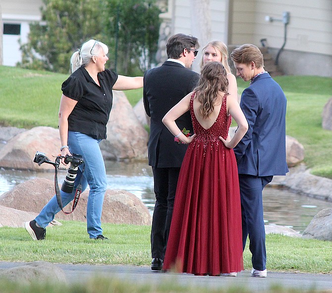 Professional photographer Belinda Grant coordinates an informal prom shoot at Genoa Lakes in May 2020 for her daughter and friends.