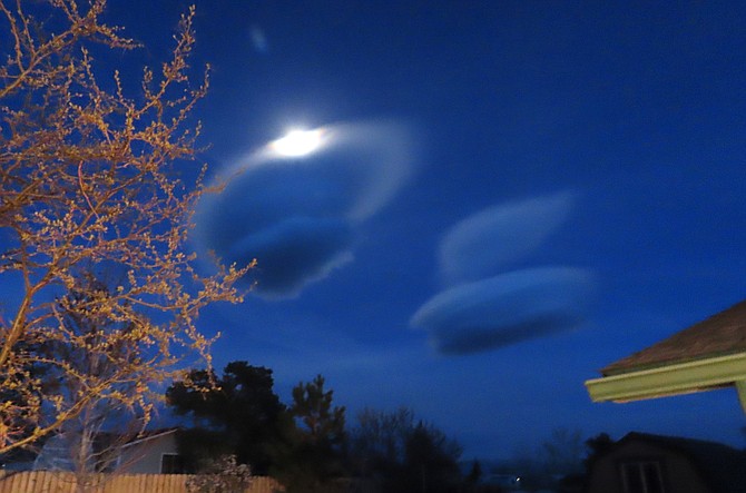 Roger Kubeck took this photo looking east at the waxing gibbous moon and glowing lenticular clouds east of Johnson Lane on Saturday night.